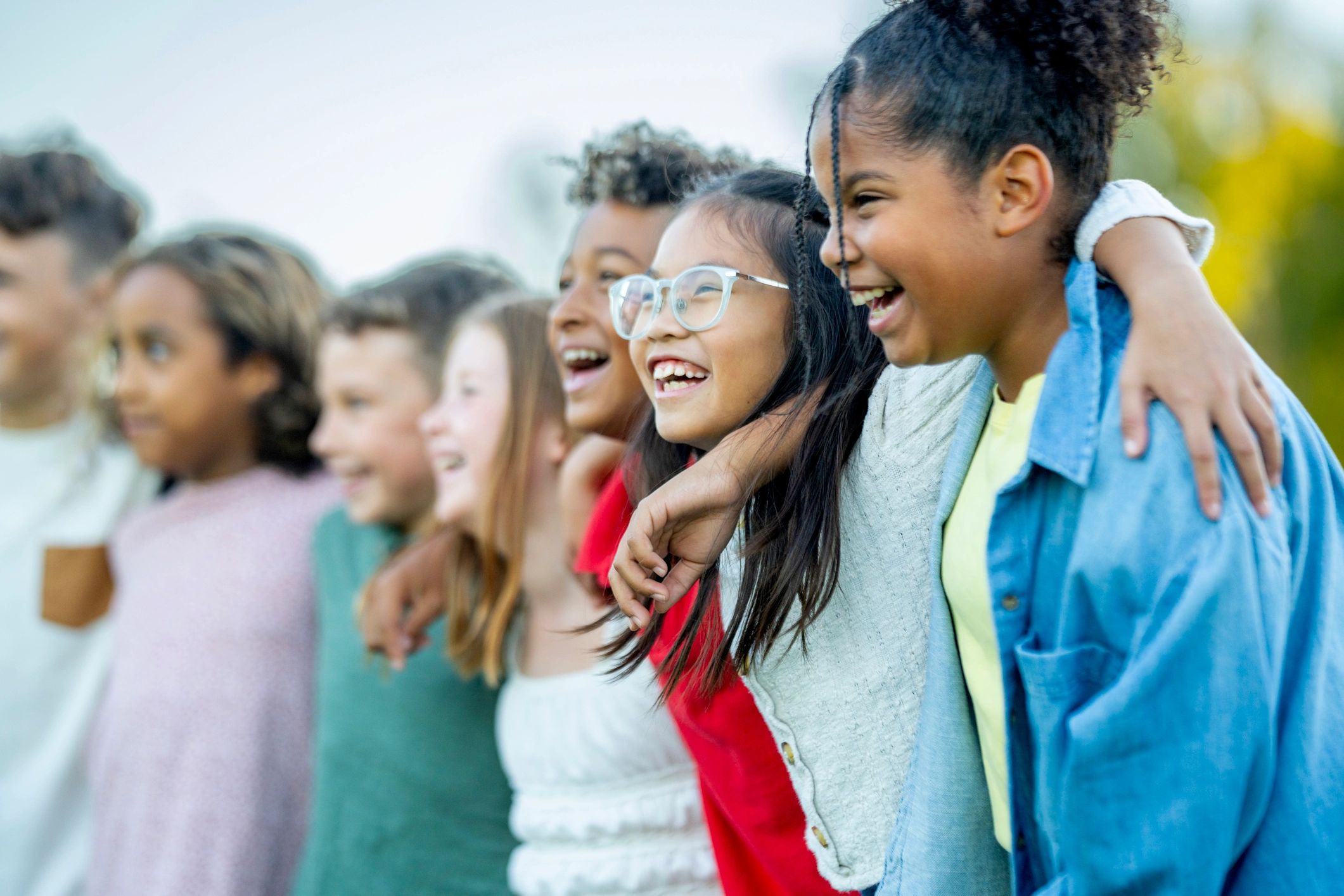 Children sharing a joyful moment outdoors